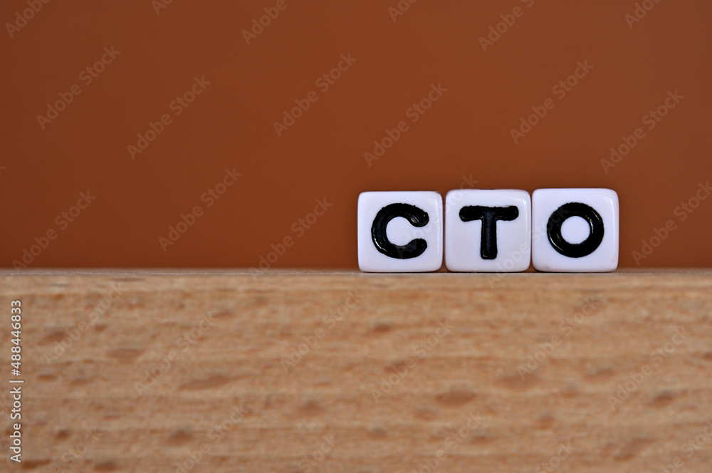 Poster word cubes lined up with the letters cto written on it. it is an abbreviation for chief technology o