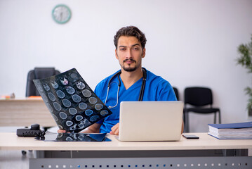 Young male doctor radiologist working in the clinic