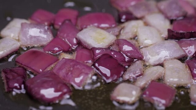 frying chopped onion on fry pan slow motion 4k 