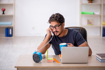 Young male designer working in the office