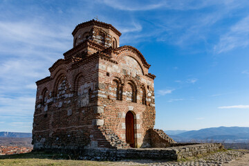 Gornji Matejevac, Serbia - February 19. 2022 Latin church Holy Trinity from the 12th century at top of a hill on a sunny spring day and beautiful sky