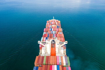 Aerial top view of cargo ship carrying container for import export goods  to customer,concept...