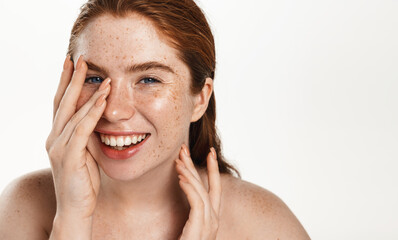Chubby girl with red hair and glowing, fresh facial skin, showering, cleansing her face and...