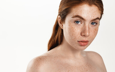 Teen curvy model with red hair and clean natural glowing skin, white smile, looking at camera....