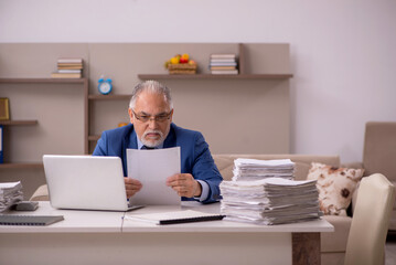 Old male boss working from home during pandemic