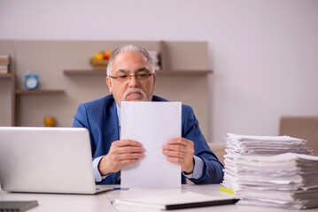 Old male boss working from home during pandemic