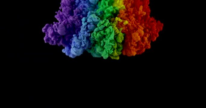 Mixing red, orange, yellow, green, blue, blue and purple paint in one rainbow cloud on a black background.