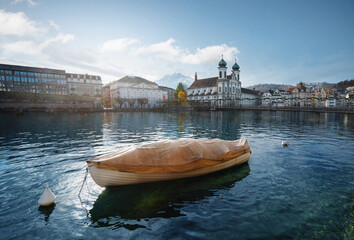 Boat at Reuss River and Luzern Skyline with Jesuit Church - Lucerne, Switzerland