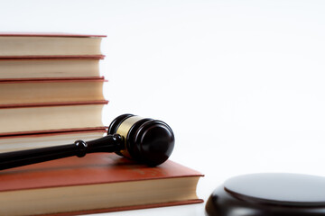 Law concept - law book with a wooden judge's gavel on table. Copy space for text
