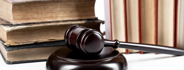 Law concept - law book with a wooden judge's gavel on table. Copy space for text