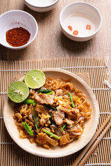 Thai food (Pad See Ew), Stir fried rice noodles with soy sauce, egg, kale and pork