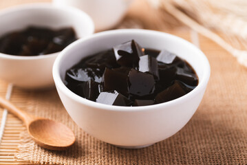 Grass jelly or herb jelly, dessert in Southeast Asia made from plant eating with syrup, bubble tea or other drinks