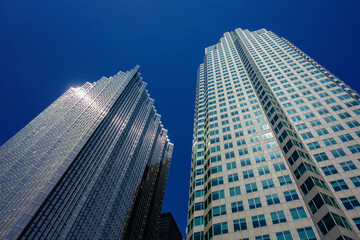 Obraz premium Skyscrapers Against Deep Blue Cloudless Sky on Sunny Day