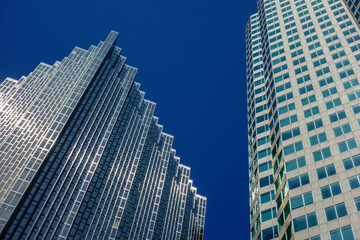 Obraz premium Skyscrapers Against Deep Blue Cloudless Sky on Sunny Day