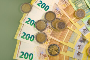 Money background.Euro currency. euro banknotes bundle on a green background.Money and finance.Finance and savings