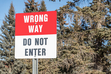 Wrong way traffic sign on city street