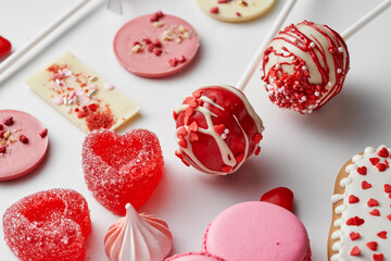 Pink and red sweets on a white background