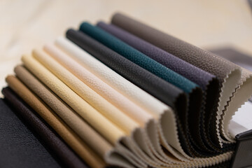 Catalog of multicolored imitation leather. Leatherette fabric texture, textile industry. Imitation...
