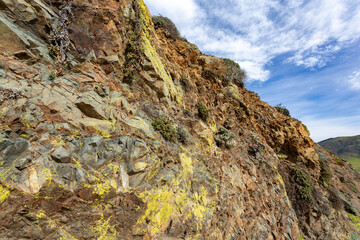 Red and yellow rocks with green moss