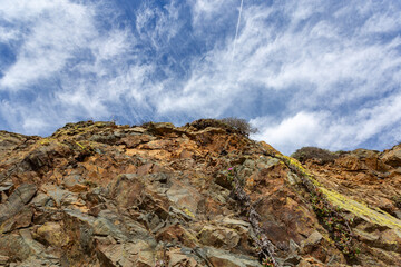 Red and yellow rocks with green moss