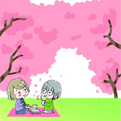 桜の木の下でお弁当を食べる女性たち