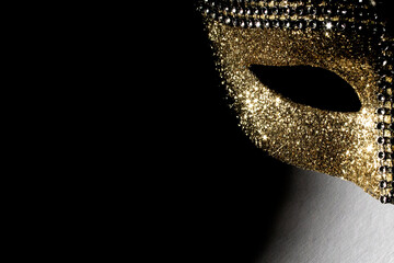 A detailed view of a gold costume mask
