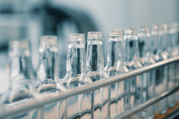 Row of glass bottles to fill with expensive alcohol drinks