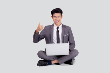 Young asian business man sitting work on laptop computer to internet online isolated on white background, businessman confident and notebook, freelance with success, marketing and communication.