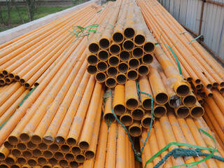 Spare iron pipes placed on the natural gas installation site
