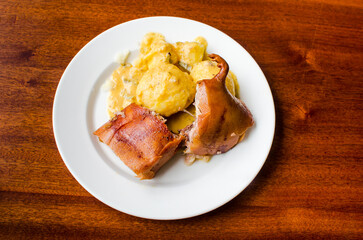 Roasted guinea pig with boiled potatoes
