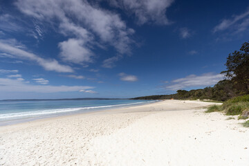 View along the white sand of Nelsons beach near Jervis Bay in NSW, Australia