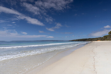 View along the white sand of Nelsons beach near Jervis Bay in NSW, Australia