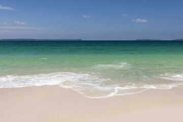 Fototapeta na wymiar Beautiful white sand at Chinamans Beach near Jervis Bay in NSW, Australia