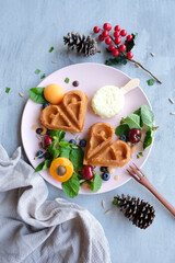 Obraz premium Homemade cooling snacks for a sunny afternoon. Fresh Fruit Waffles with Ice Cream. Healthy and delicious, easy to make with ingredients available at major supermarkets.