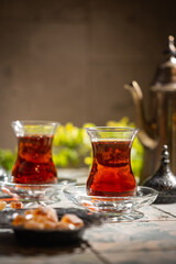 Turkish tea in traditional glass closeup on tile background