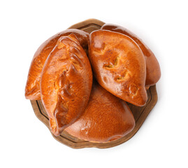 Wooden board with delicious baked patties on white background, top view