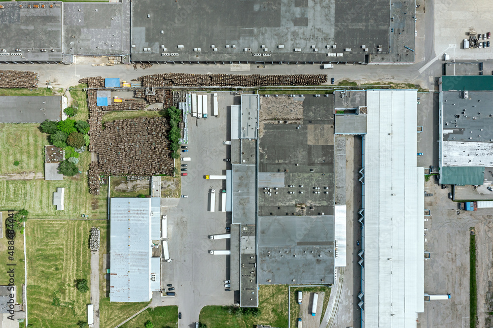 Wall mural aerial view of goods warehouse. logistics center in suburb industrial area from above.