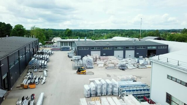 Forklift truck driving in hardware material factory yard