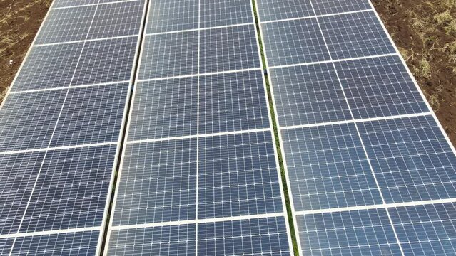 Detail of solar panel delivering green energy of farmland in Africa, aerial