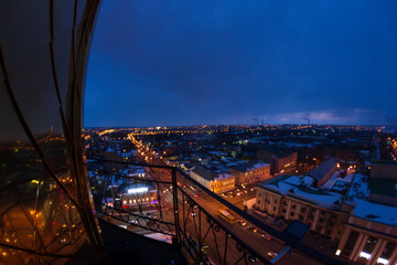 Fototapeta na wymiar Night panorama of the city with illuminated buildings. Sights of Izhevsk.