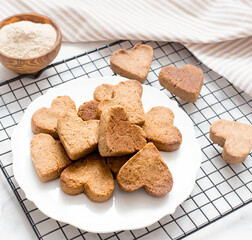 homemade heart-shaped cookies cool on the grill, valentine's day gift with love, gluten-free buckwheat flour pastries.