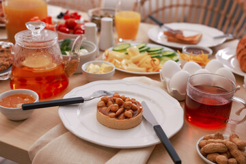 Dishes with different food on table indoors. Luxury brunch
