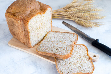 Baked fresh homemade bread on a wooden board. Yeast-free bread. Homemade cakes.