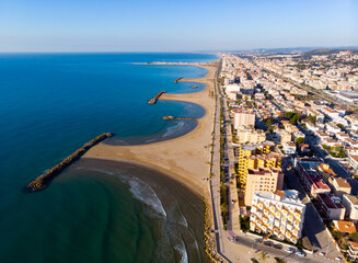 Aerial drone view of Playa de Cunit on sunny winter day, Tarragona, Spain - obrazy, fototapety, plakaty