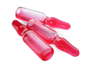 Glass ampoules with pharmaceutical product on white background