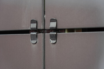 black square ventilated ceramic panels installed on the facade of the building. Special fastener...