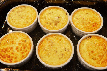 Creme brulee with mushrooms in special form was taken out of the oven after baking. French gourmet cuisine