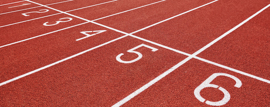 Red runninng race track with lane numbers closeup, Treadmill at stadium, Summer sport and fitness concept