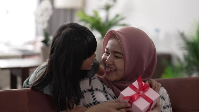 excited mother get new suprise present from her little girl