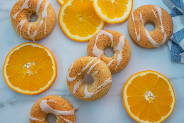 sweet home made orange donuts on a table